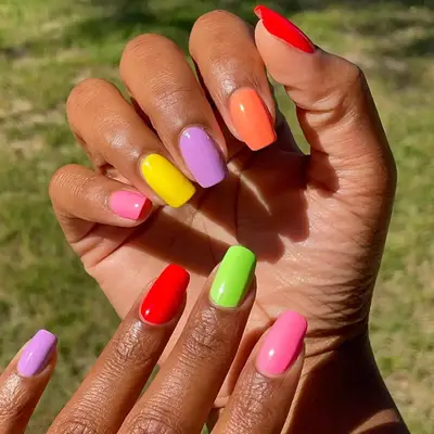 rainbow manicure with different color on each nail