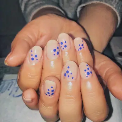 Nude nails with blue dots