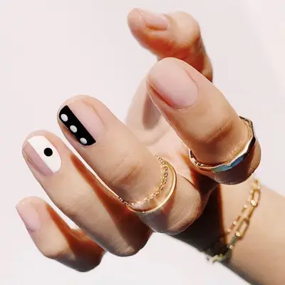 Black and white graphic negative space manicure