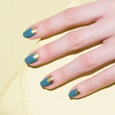 Teal nails with gold half moon cuticles