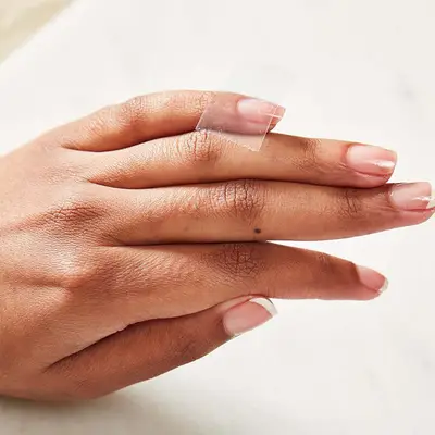 Tape on the end of a fingernail.