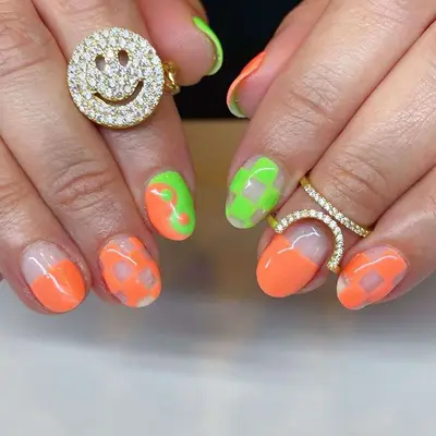 neon coral and green nails with designs