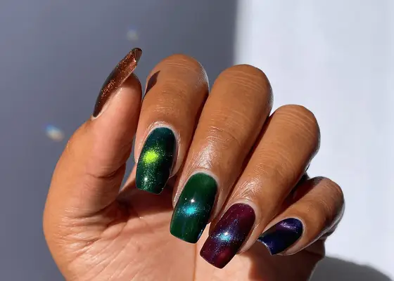 Dark velvet skittle manicure on long square nails