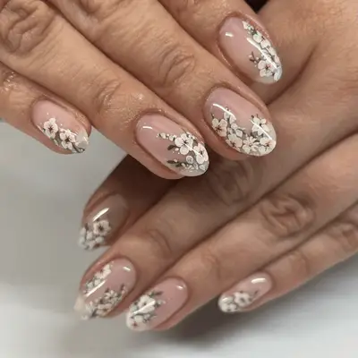 Neutral manicure with milky white swirl designs