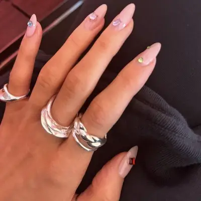 gemstone 3D manicure nails closeup pink base