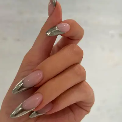 Kylie Jenner wearing chrome french nails