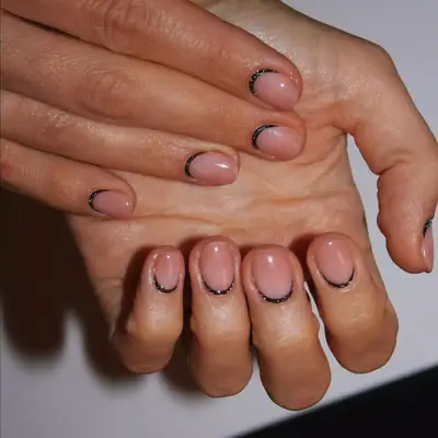black reverse french with nude nails