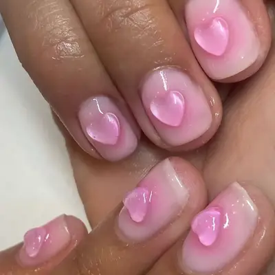 baby pink aura nails with a 3d bubble heart