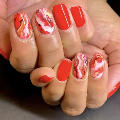 poppy red marble manicure