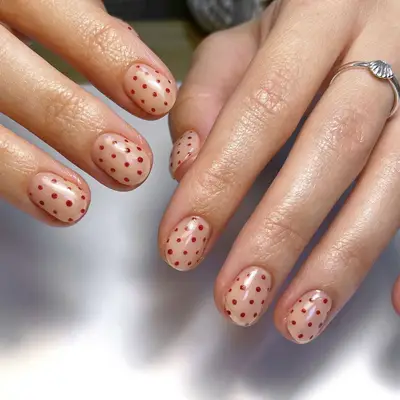 red polka dot nails
