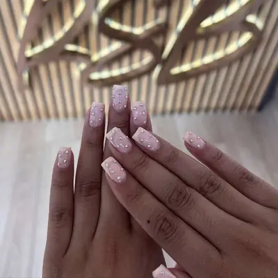pale pink french manicure with rhinestones