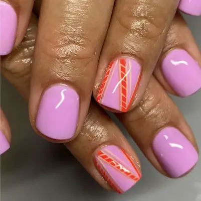 bubblegum pink manicure with red accent nail design