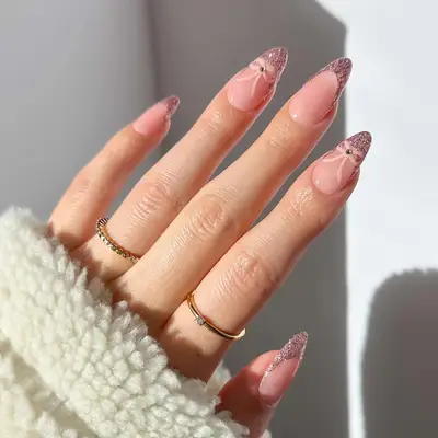 glittery french manicure with bow details