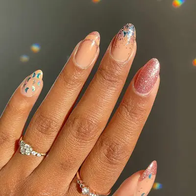 a shimmery pink holiday mismatched manicure