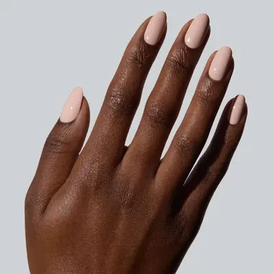 model with light beige pink nails