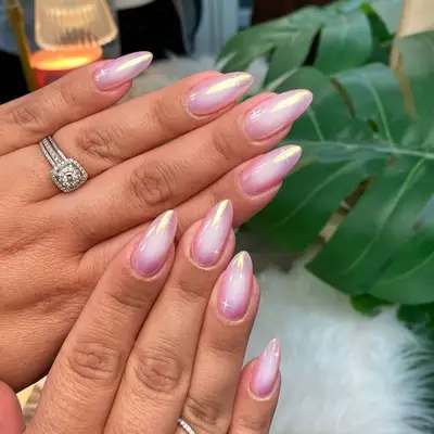 manicure with light pink shimmer and sparkle design