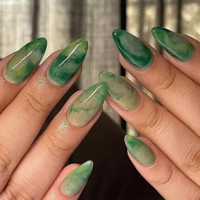 model with green watercolor nails