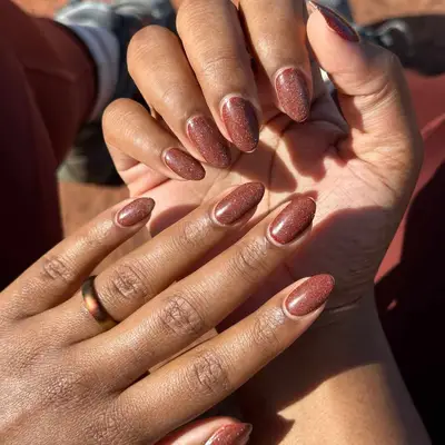 warm brown nails with subtle shimmer finish