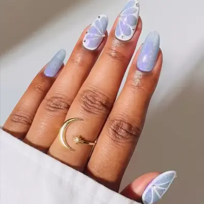 Baby blue butterfly sparkly manicure.