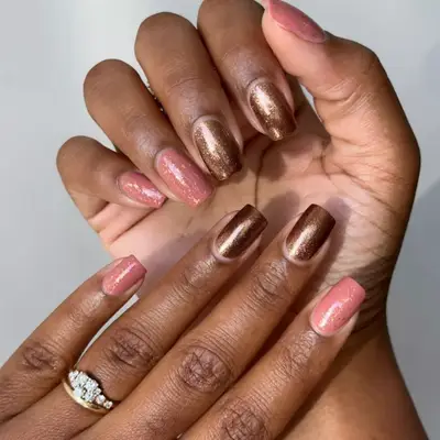 Bronze and pink sparkly manicure.