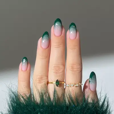 a green french manicure with sparkles