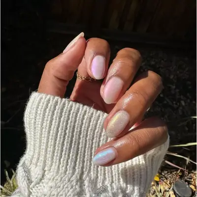 Opalescent sheer milky white sparkly manicure.