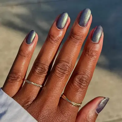 an iridescent dark manicure 