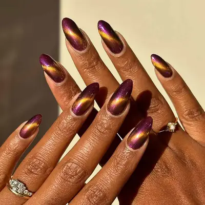 a purple and gold shifty magnetic manicure 