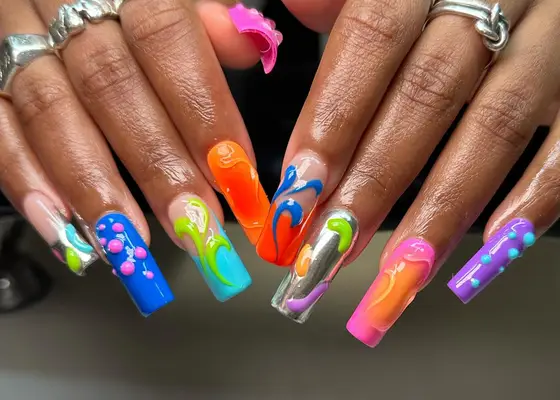 Mismatched colorful designs on long coffin nails