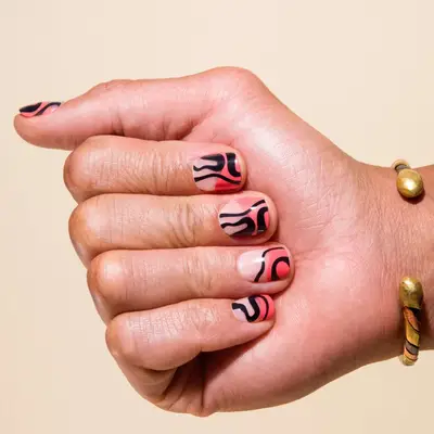 Coral, black, and negative space swirls