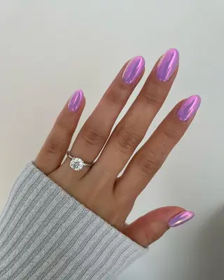 Lavender chrome nails with a pink shift.