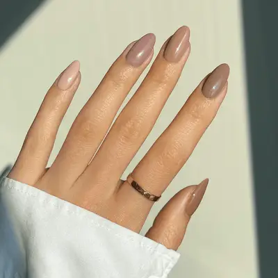 Skittle nails with shades of mauve, tan, cream, and light brown.