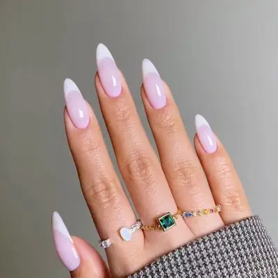 Manicure with pastel pink base and creamy French tip