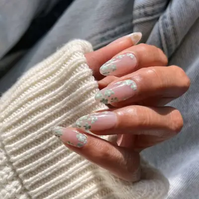 Manicure with small mint floral designs