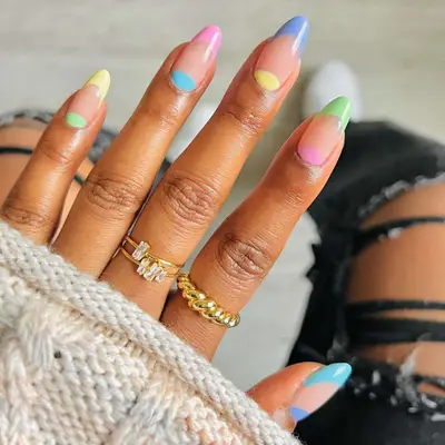 Manicure with pastel color block French tips and cuticle accents