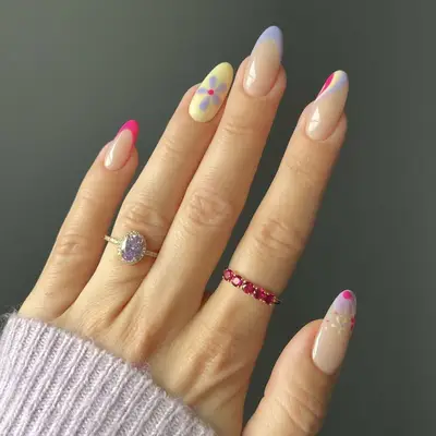 pastel purple and pink manicure with floral accents