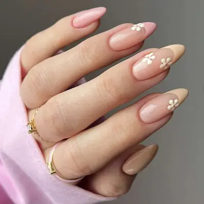 pink and tan french manicure with flower designs