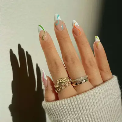 white french tips with colorful sguiggly designs
