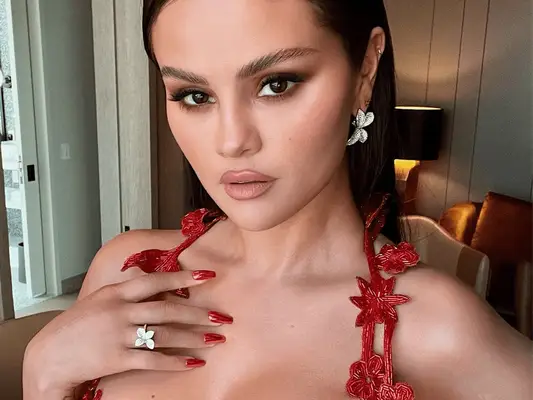 Selena Gomez wearing fire chrome nails