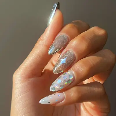 model with sparkly silver velvet nails with sparkly rhinestones