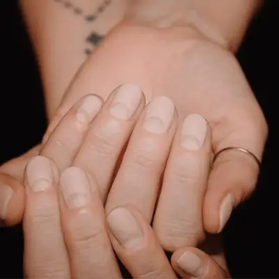 Nude nails with negative space half moons