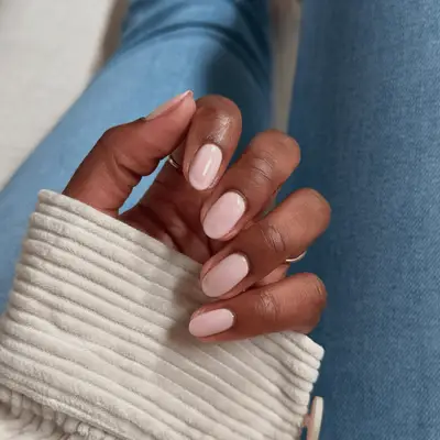 Short nails with sheer baby pink nail polish
