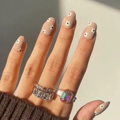 Nude nails with small floral detail