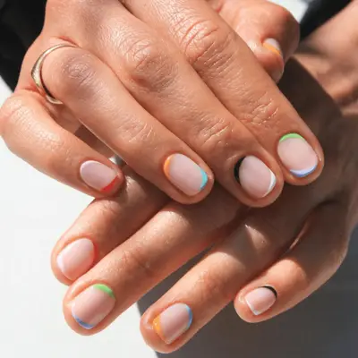 Nude nails with multi-colored tips and bases