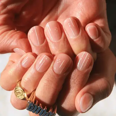 Short nude nails with white detail