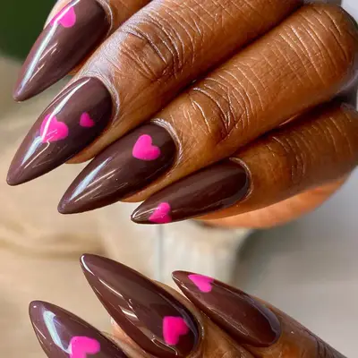 Brown nails with pink hearts