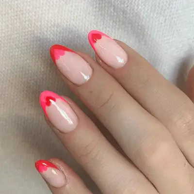pink heart-shaped tipped manicure
