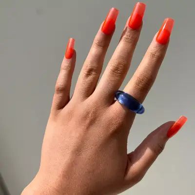 Short natural nails with pale yellow polish 