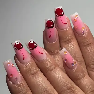 Long pink coffin nails with cherries and 3-D bubbles 