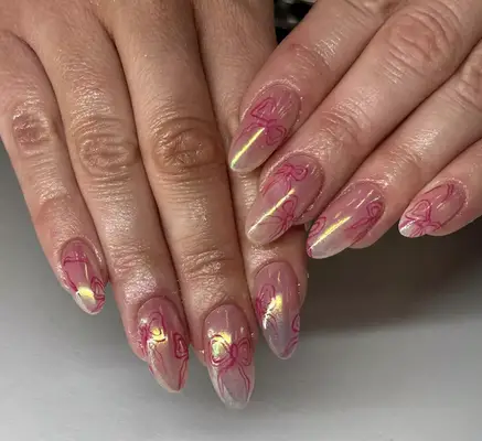 pink chrome nails with ribbon design